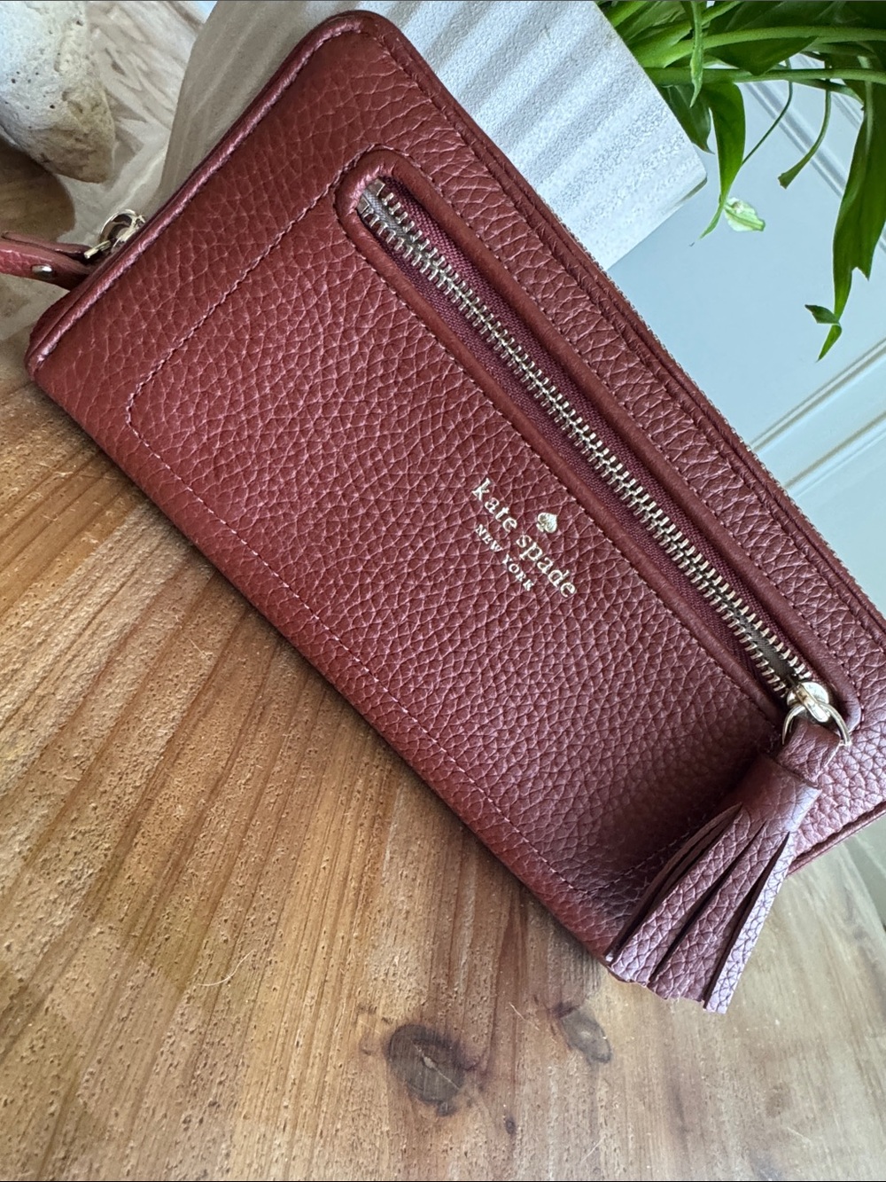 kate spade pebbled leather wristlet in brick red